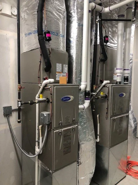 Carrier furnaces and venting installed in the mechanical room at the Fillmore County maintenance building